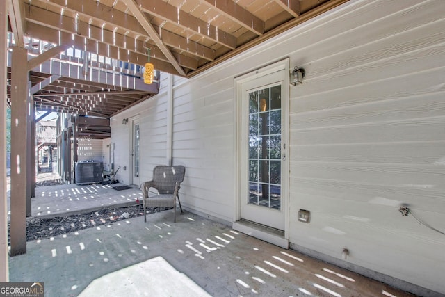 view of patio / terrace featuring central AC and stairs