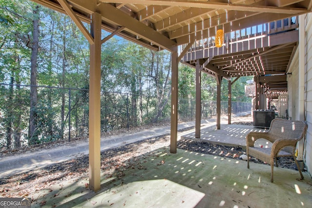 view of patio / terrace with fence and cooling unit