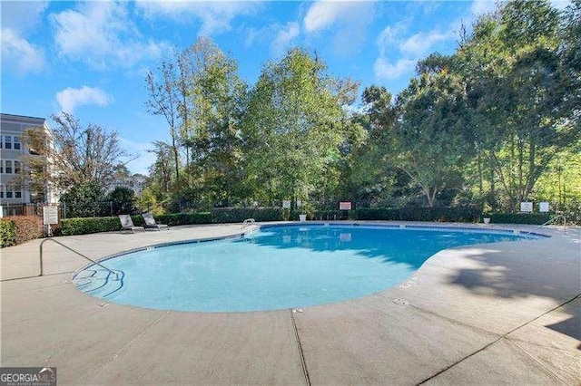 view of swimming pool featuring a patio