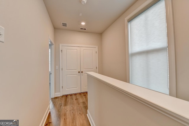 hall with light hardwood / wood-style flooring