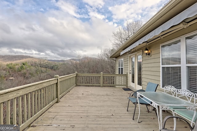 wooden terrace with a mountain view