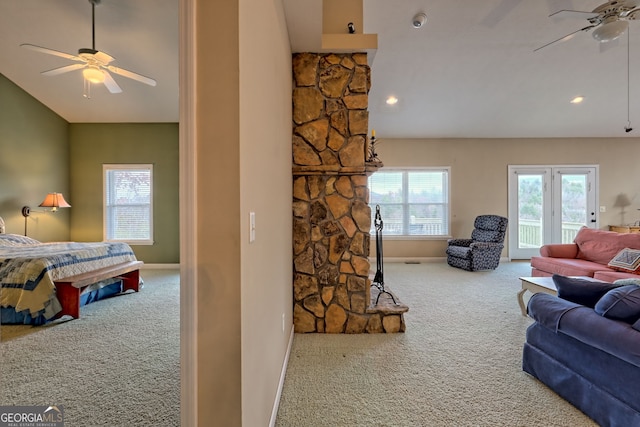 carpeted living room featuring ceiling fan and plenty of natural light