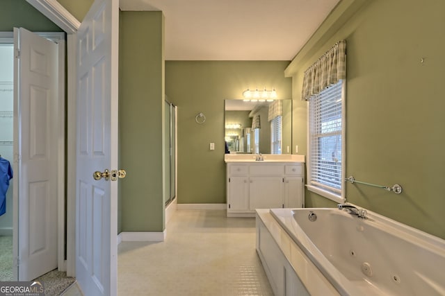 bathroom featuring vanity and independent shower and bath