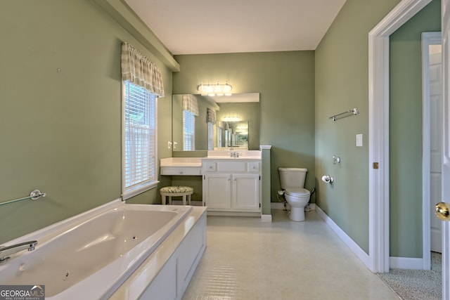 bathroom featuring a bath, vanity, and toilet