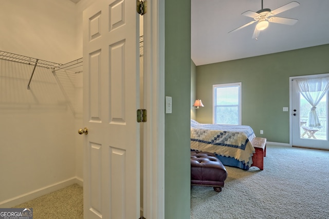 bedroom featuring ceiling fan, access to exterior, and carpet floors