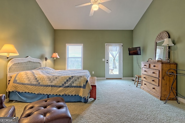 carpeted bedroom featuring access to exterior, ceiling fan, and lofted ceiling