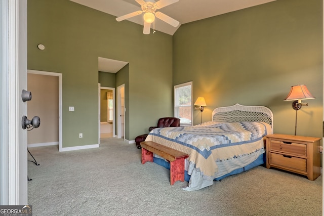 bedroom featuring light colored carpet, high vaulted ceiling, and ceiling fan