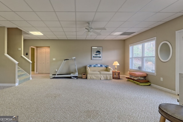 recreation room with a paneled ceiling, ceiling fan, and light carpet