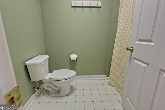 bathroom featuring toilet