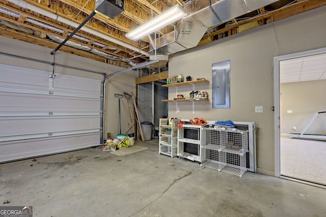 garage featuring a garage door opener and electric panel