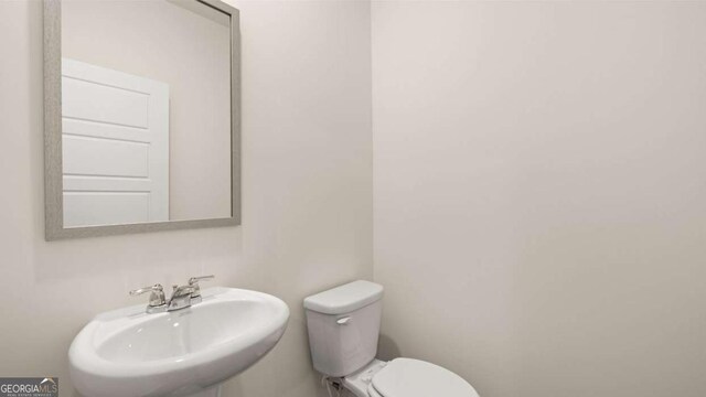 bathroom with toilet and sink