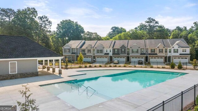 view of swimming pool with a patio area