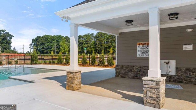 view of pool featuring a patio area