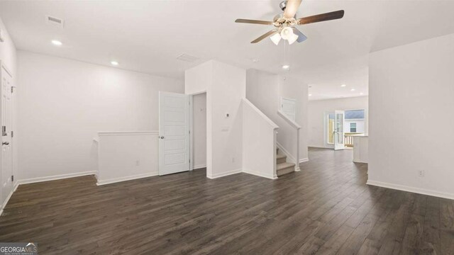 spare room with ceiling fan and dark hardwood / wood-style flooring