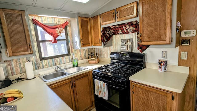 kitchen featuring black gas range and sink