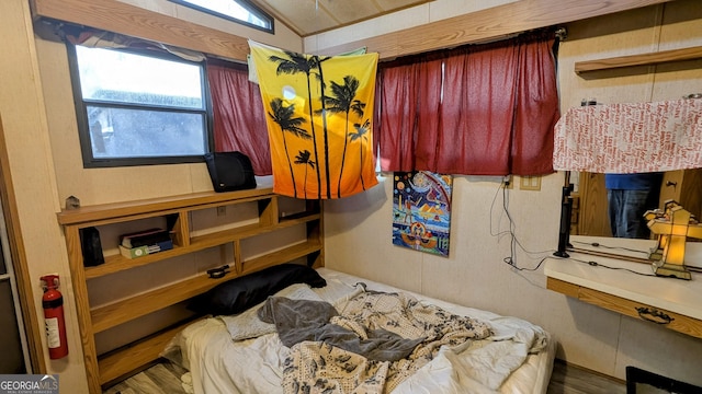 bedroom featuring lofted ceiling