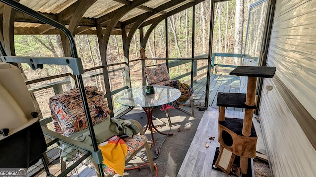 sunroom / solarium featuring a healthy amount of sunlight