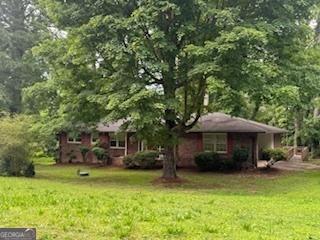 4485 Canary Ct, Lithia Springs, GA 30122 - view of front of property with a front lawn