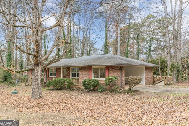4485 Canary Ct, Lithia Springs, GA 30122 - view of front facade featuring brick siding, driveway, and a carport