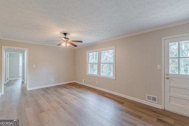 unfurnished room with ceiling fan, ornamental molding, and light hardwood / wood-style floors