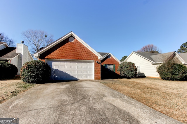 1624 Graystone Dr, Hampton, GA 30228 - view of side of property featuring brick siding, concrete driveway, a lawn, and an attached garage
