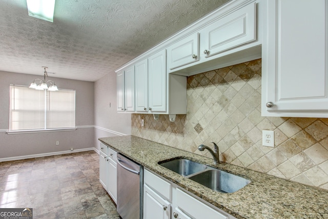 kitchen with dishwasher, white cabinets, decorative light fixtures, and sink