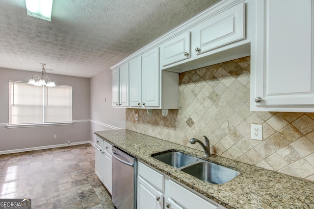 1624 Graystone Dr, Hampton, GA 30228 - kitchen featuring dishwasher, backsplash, a chandelier, white cabinets, and a textured ceiling