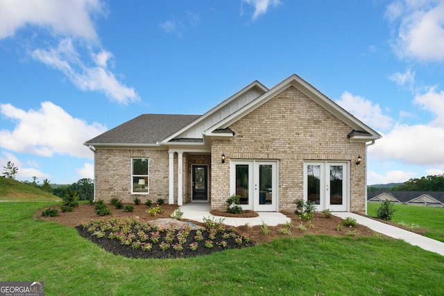 craftsman house featuring french doors and a front yard