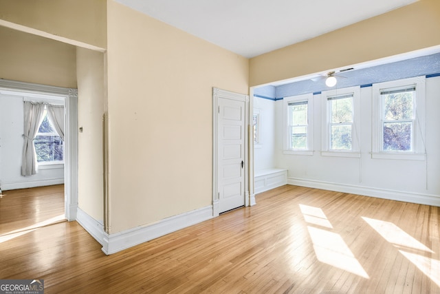 unfurnished bedroom featuring light hardwood / wood-style floors and multiple windows