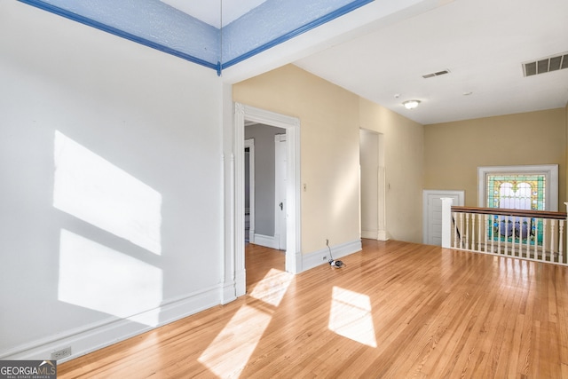 empty room with hardwood / wood-style floors