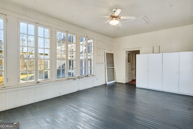 interior space featuring ceiling fan and dark hardwood / wood-style flooring