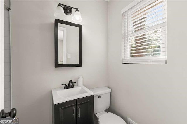 bathroom with vanity and toilet