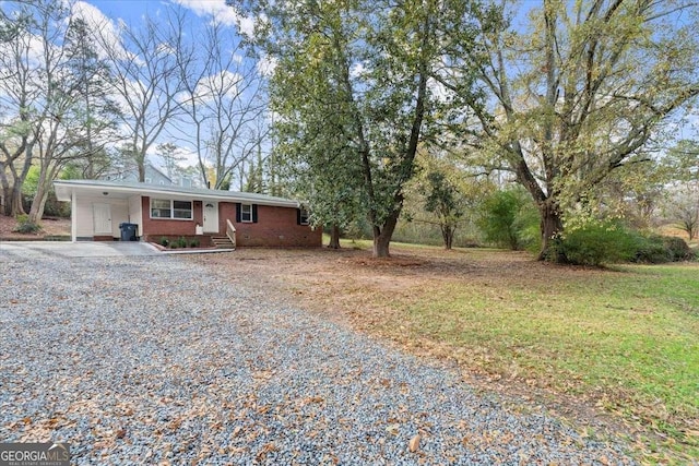 single story home with a carport and a front yard