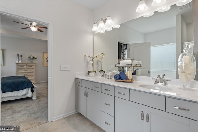 bathroom featuring tile patterned floors, vanity, and ceiling fan