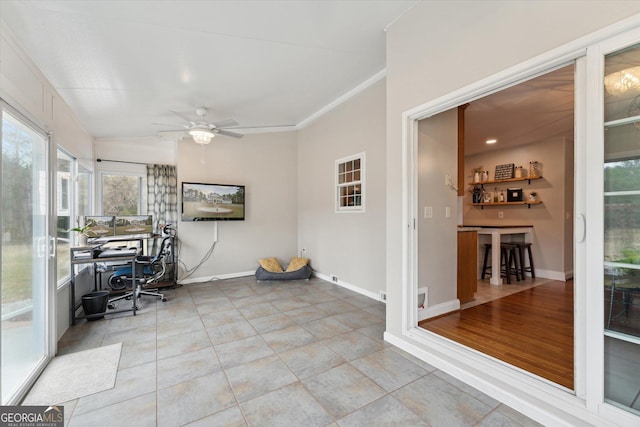 interior space with ceiling fan