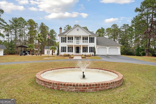 neoclassical home with covered porch, a balcony, and a front lawn