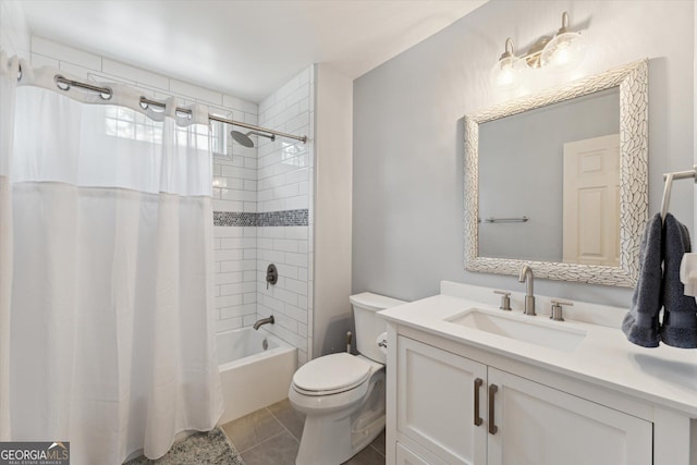 full bathroom with tile patterned flooring, vanity, shower / tub combo, and toilet