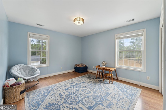 sitting room featuring light hardwood / wood-style flooring