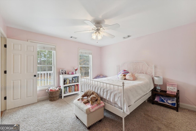 carpeted bedroom with ceiling fan