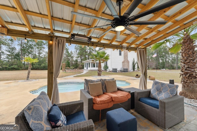 view of patio featuring ceiling fan and an outdoor living space