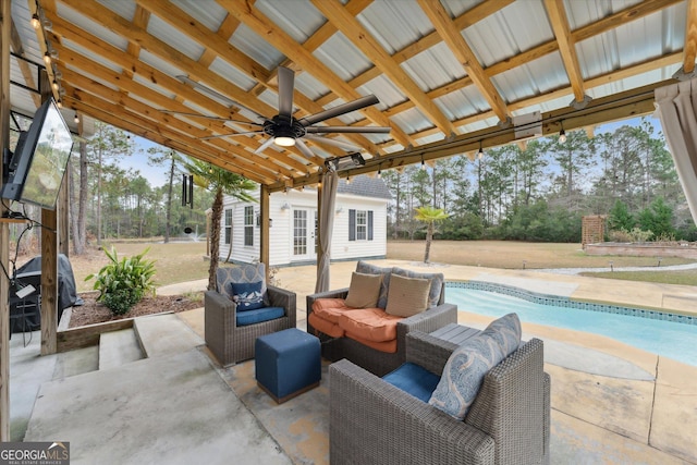 view of patio / terrace featuring an outdoor hangout area, ceiling fan, and an outdoor structure