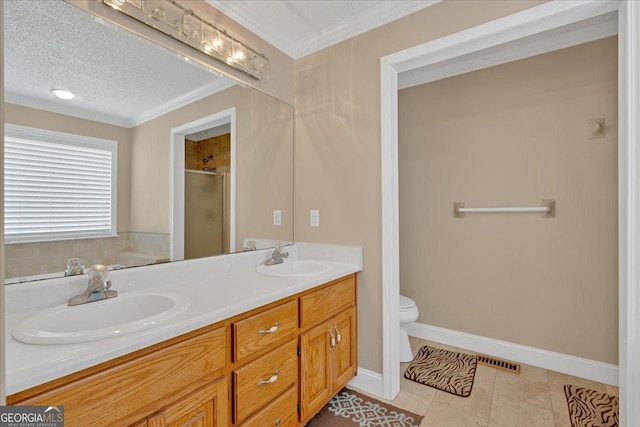 bathroom with tile patterned floors, toilet, crown molding, and a textured ceiling