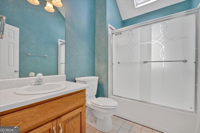 full bathroom featuring a skylight, tile patterned flooring, toilet, shower / bath combination with glass door, and vanity