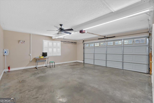 garage featuring a garage door opener and ceiling fan