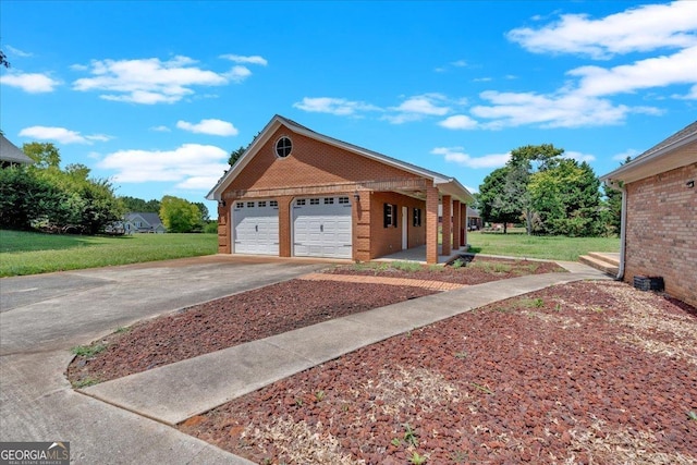 view of front of property with a garage and a front lawn