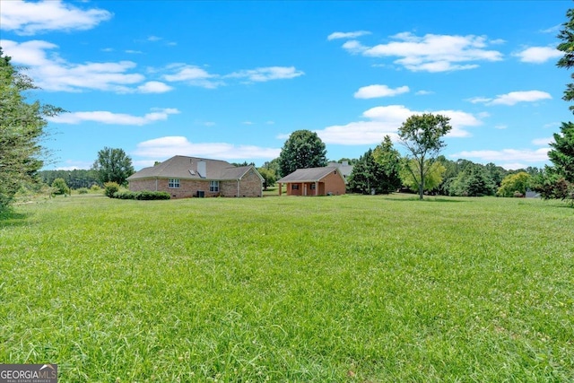 view of yard with a rural view