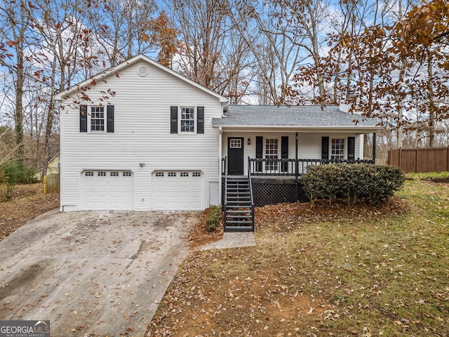 view of front of house with a porch and a garage