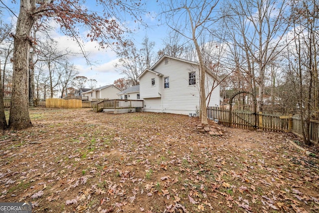 back of property featuring a deck