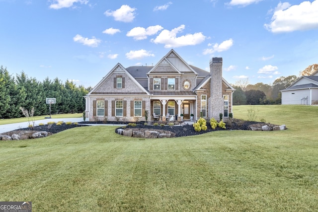 view of front of house with a porch and a front lawn