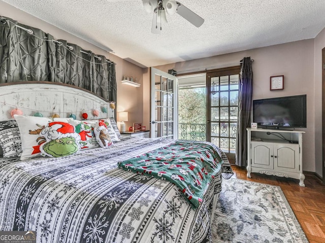 bedroom with ceiling fan, access to exterior, a textured ceiling, and dark parquet floors